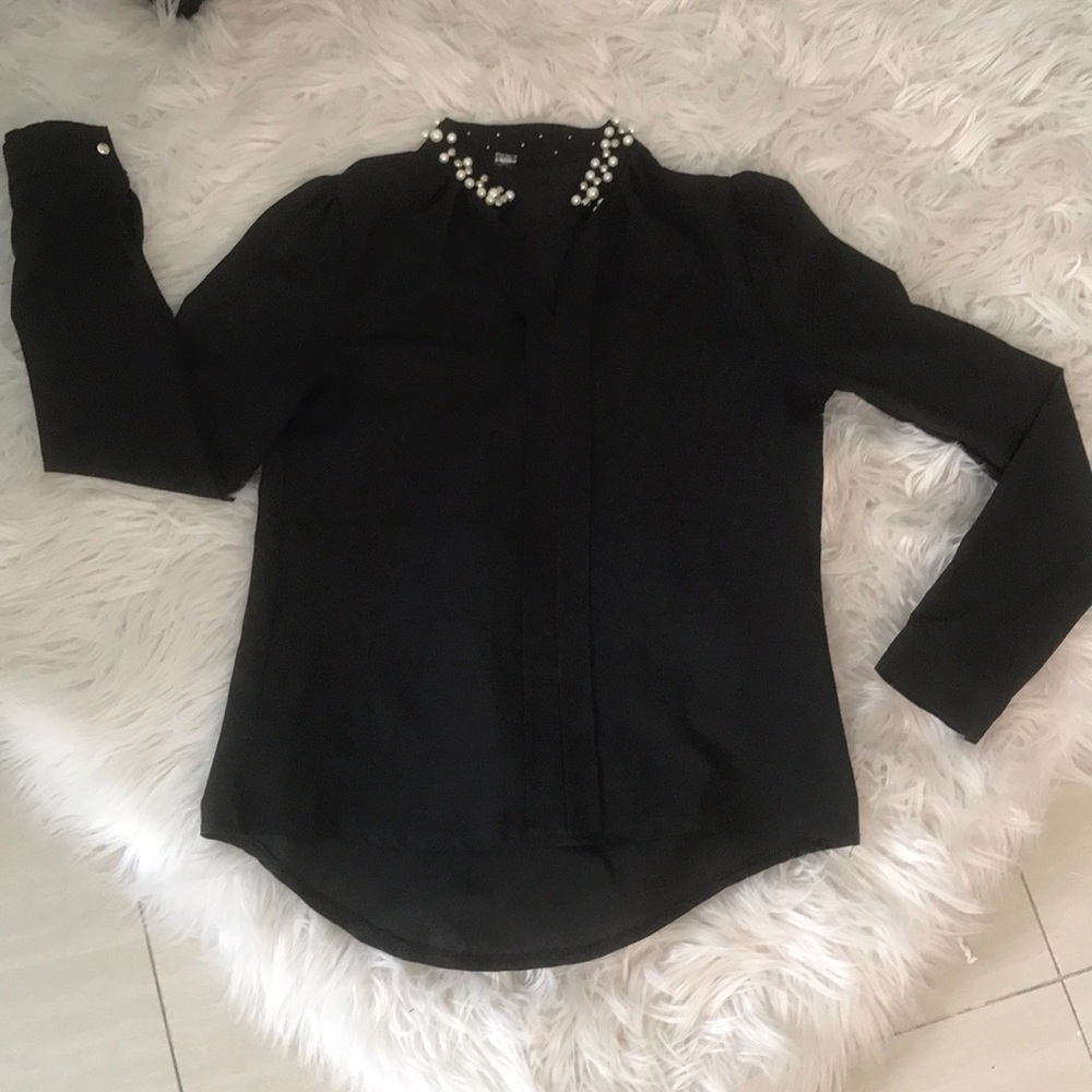 Black shirt , pearls